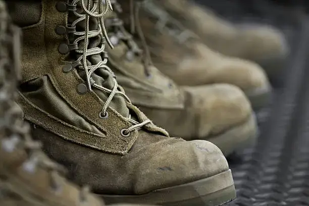 A row of worn down combat boots