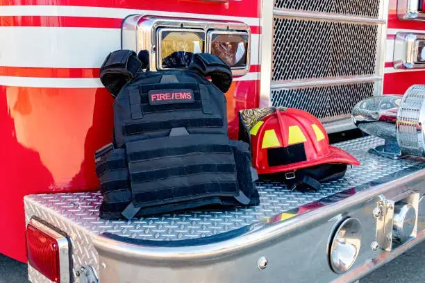 Firefighter and EMS tactical vest displayed on a fire truck